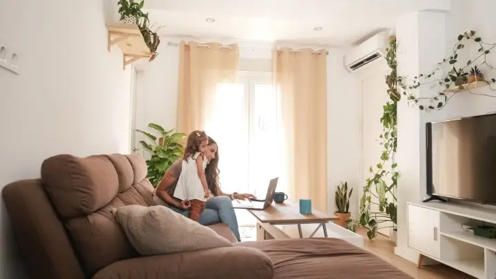J & J Heating and Air Conditioning Girl with mother comfortable at home